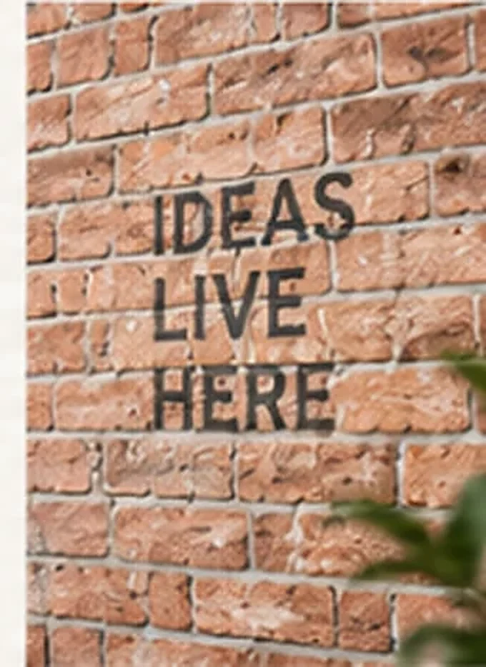 Exposed red brick surface with printed typography